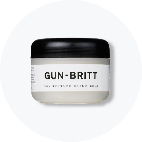 Her ses Gun-Britt Dry Texture Crème i en lys rund beholder med sort låg. På emballagen står “Gun-Britt”, “Dry Texture Crème” og “100 ml”.