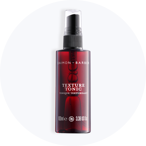 Daimon Barber Texture Tonic i en rød sprayflaske, 100ml.