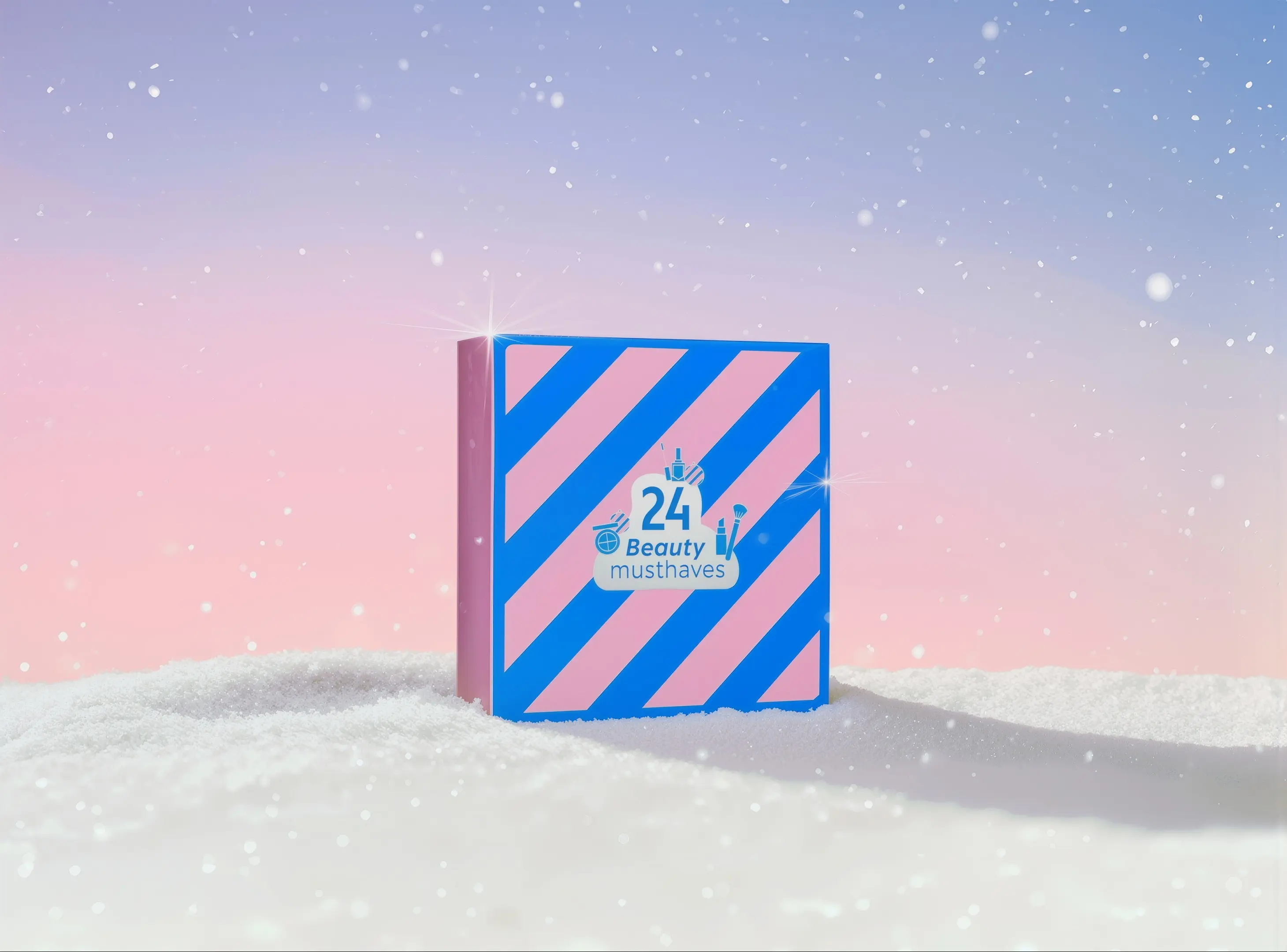 En lyserød og blåstribet æske med teksten '24 Beauty musthaves' og skønhedsikoner, stående i sne.