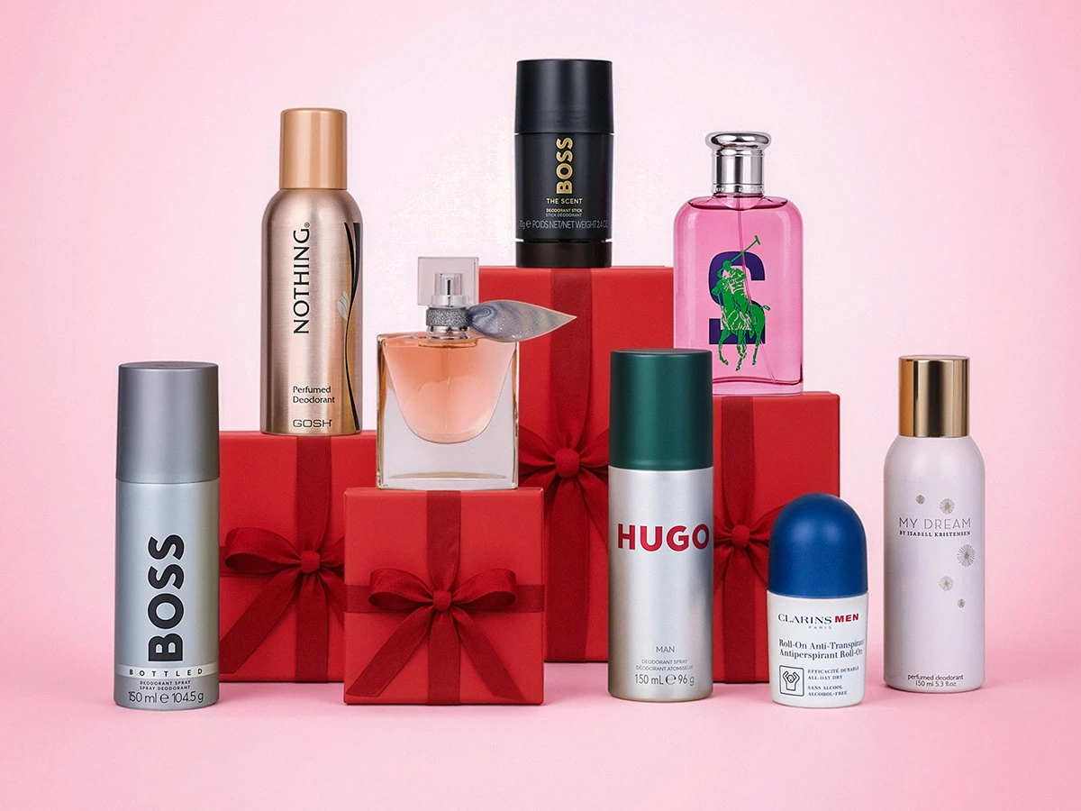 Et udvalg af parfumer og deodoranter fra mærker som Boss, Gosh, Hugo og Clarins, arrangeret på røde gaveæsker.