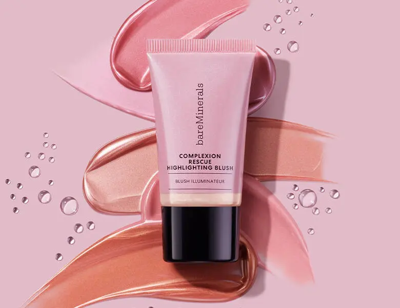 Her ses en lyserød baggrund med et lyserødt bareMinerals produkt.