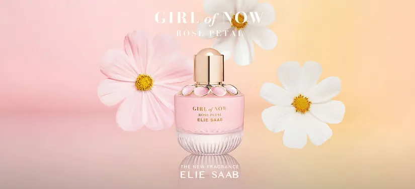 Her ses en Elie Saab parfume på en gul og lyserød baggrund med blomster.