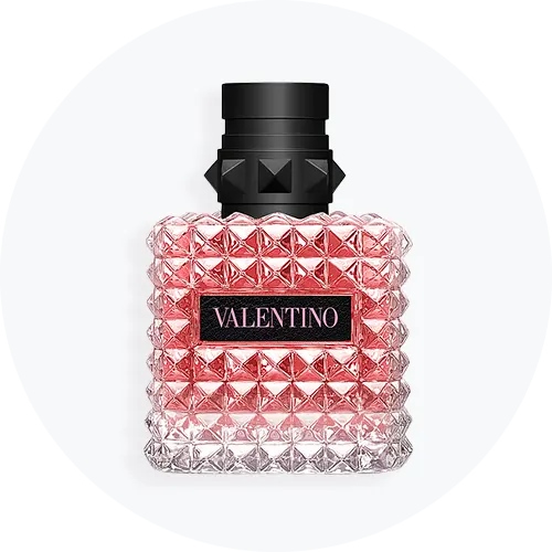 Her ses en lyserød Valentino parfume med sort låg på en lys baggrund. 