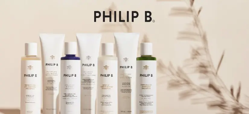 Her ses flere hvide Philip B produkter på række. Baggrunden er lys og for oven ses deres logo.