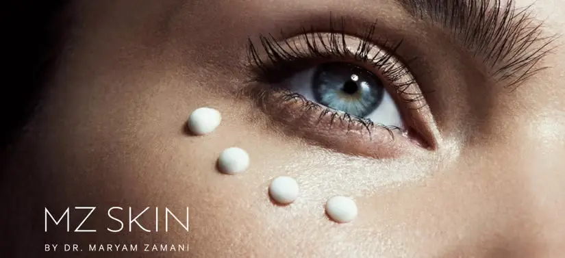 Her ses et close-up billede af en kvindes øje, hvor der under er fire prikker af et MZ SKIN produkt, samt deres logo o venstre nederste hjørne.