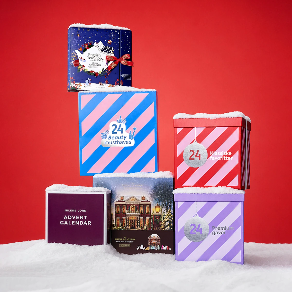 Seks sne-dækkede julekalendere fra English Tea Shop, '24 Beauty musthaves', '24 Klassiske favoritter', Nilens Jord, 'The Ritual of Advent' og '24 Premium gaver'.