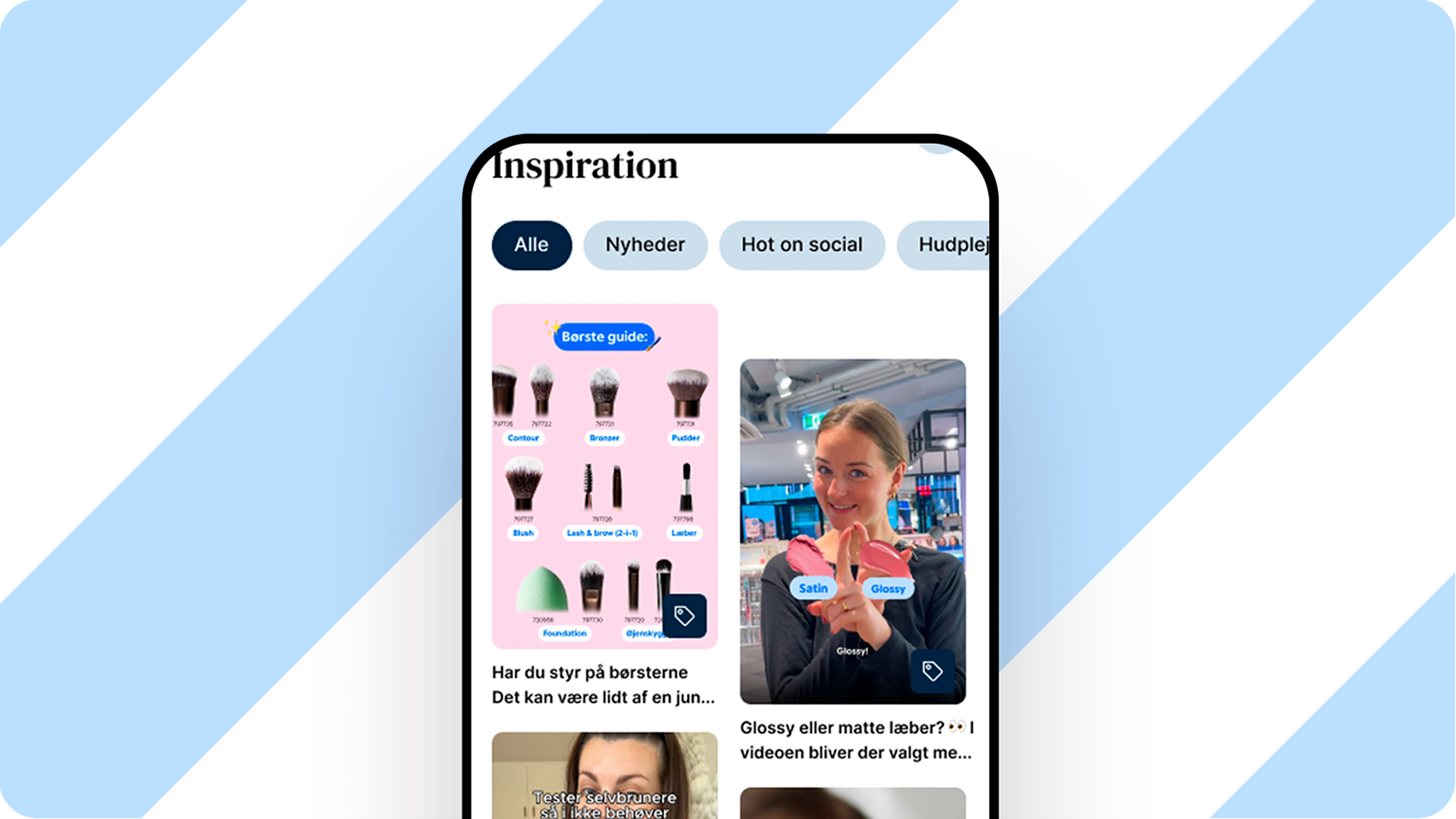 Mobilappens 'Inspiration'-feed viser en 'Børste guide' og en video 'Glossy eller matte læber?' med 'Satin' og 'Glossy' produkter.