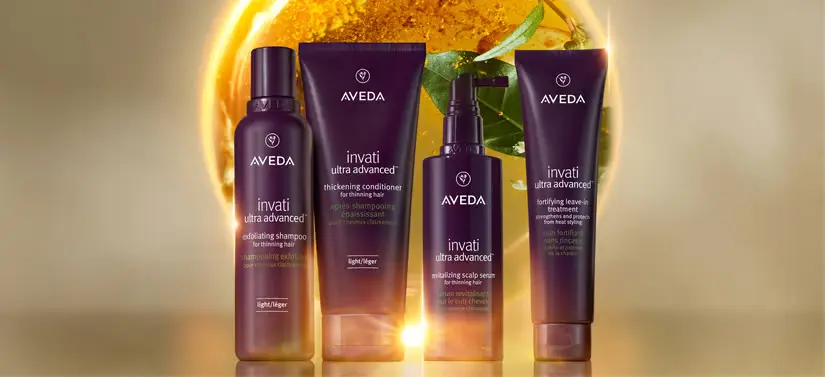 Fire Avedaprodukter på en lysende baggrund