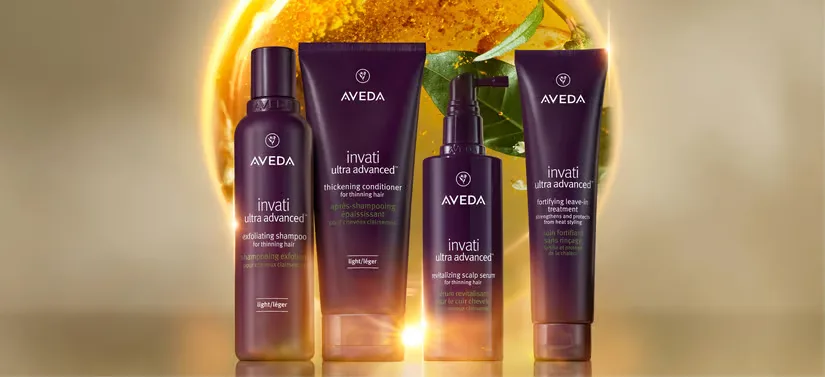 Fire Avedaprodukter på en lysende baggrund