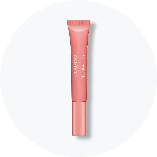 Her ses Clarins Lip Perfector i en rosa tube med matchende låg. På emballagen står “Clarins Paris” og “Lip Perfector”.