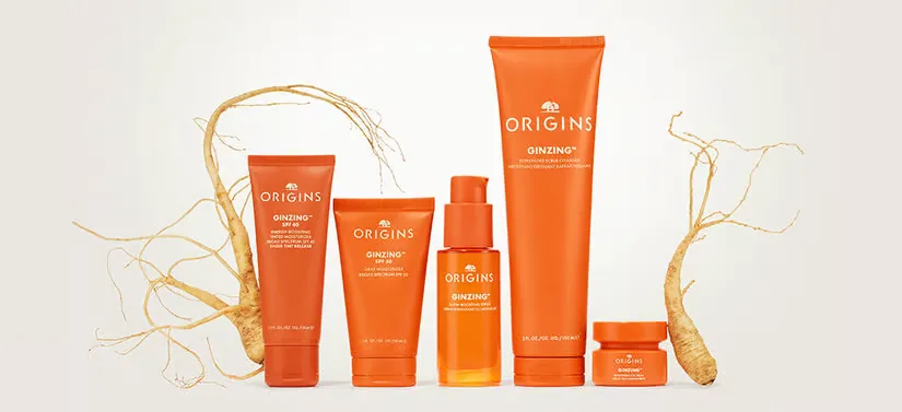 Her ses en lys baggrund med to rødder og fem orange produkter. 