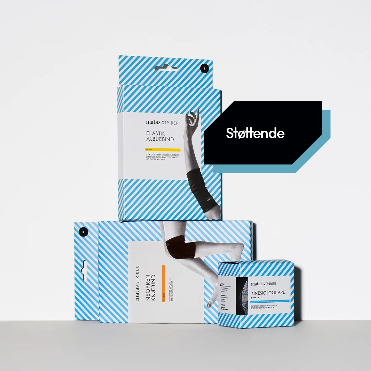 Her ses Matas Striber støttende produkter, herunder elastisk albuebind, neopren knæbind og kinesiologitape, på en hvid baggrund med lyseblå diagonale striber langs kanten. Teksten "Støttende" står nederst på billedet.