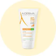 Her ses en solcreme fra A-Derma med faktor 50 og uden parfume. Den står på en lysegul baggrund. 