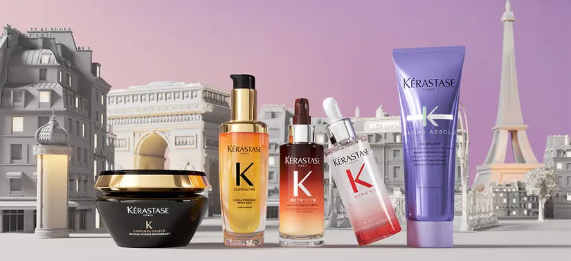 Her ses en by med lilla himmel. Foran ses fem Kérastase produkter. 