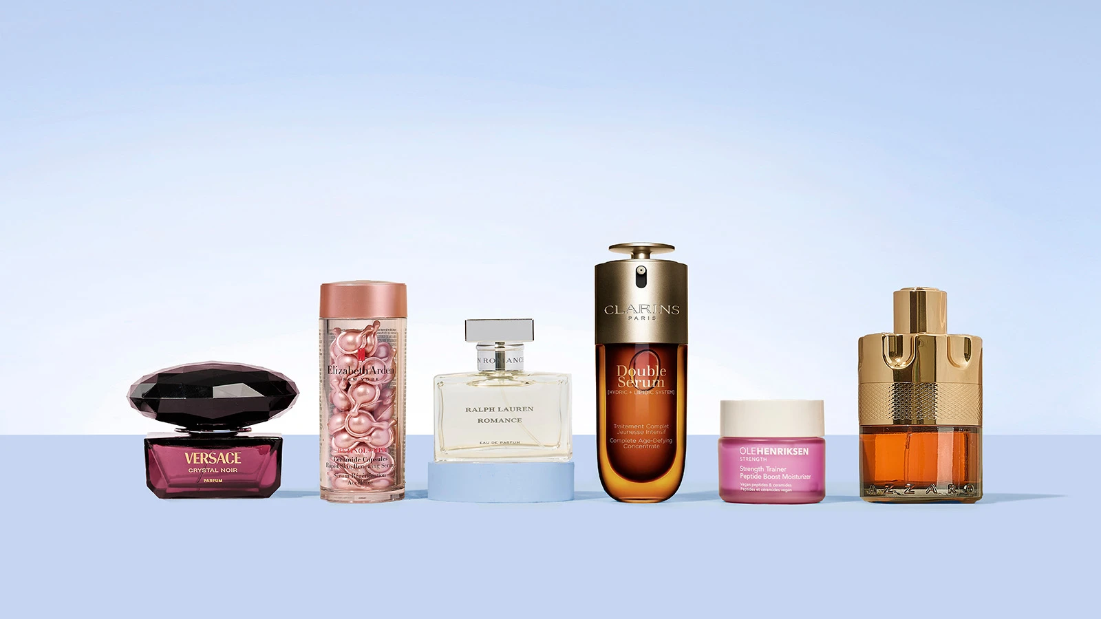 Seks forskellige skønhedsprodukter: Versace parfume, Clarins serum, Ole Henriksen fugtighedscreme og mere.