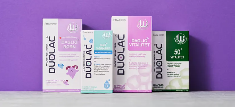 Her ses en lilla baggrund med fire forskellige Duolac produkter. 