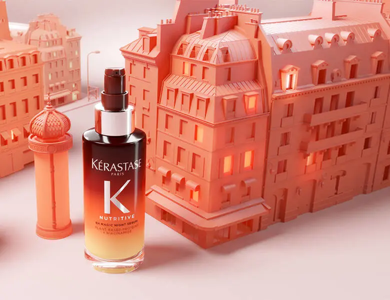 Her ses en laksefarvet legoby med et Kérastase produkt, som hovedsageligt er brunt. 