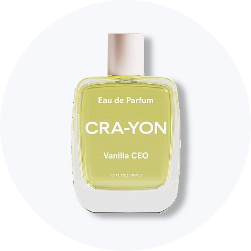 Her ses et billede af en parfumeflakon fra CRA-YON placeret centralt mod en lys, rund baggrund. På flakonen står teksten “Eau de Parfum CRA-YON Vanilla CEO”. Flakonen er i lysegul nuance med lyst låg.