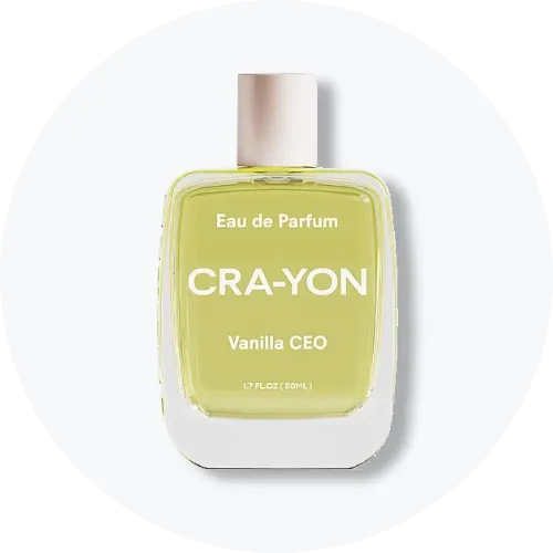 Her ses et billede af en parfumeflakon fra CRA-YON placeret centralt mod en lys, rund baggrund. På flakonen står teksten “Eau de Parfum CRA-YON Vanilla CEO”. Flakonen er i lysegul nuance med lyst låg.