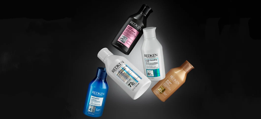 Assorterede Redken hårprodukter: Acidic Color Gloss, Acidic Bonding Concentrate, Acidic Bonding Curls, Extreme og All Soft.