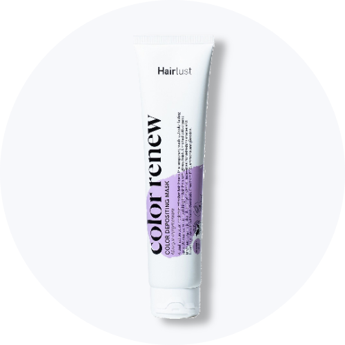 En hvid tube med Hairlust color renew FARVEAFLEJRENDE MASKE og lilla skrift.