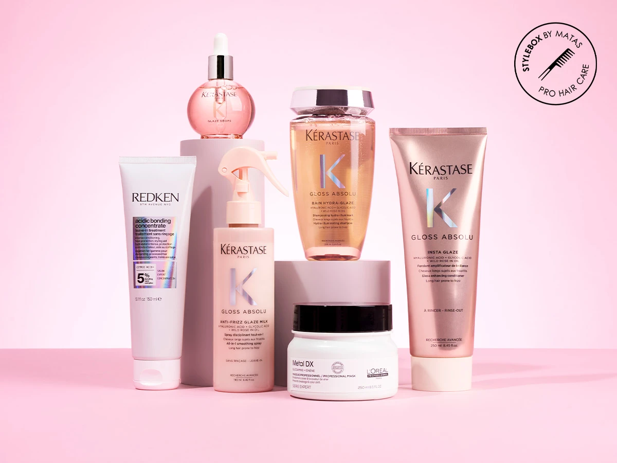 En samling af Kérastase, Redken og L'Oréal hårplejeprodukter. Stylebox by Matas Pro Hair Care logo.