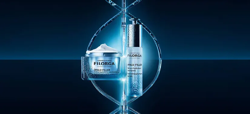Her ses en blå baggrund med to blå produkter i noget, som ligner en dna-streng. 