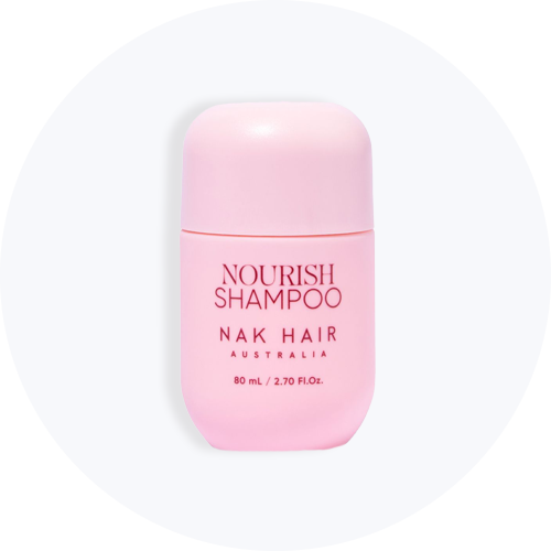 Lyserød flaske med NAK Hair Nourish Shampoo fra Australien, 80 ml / 2,70 fl.oz.