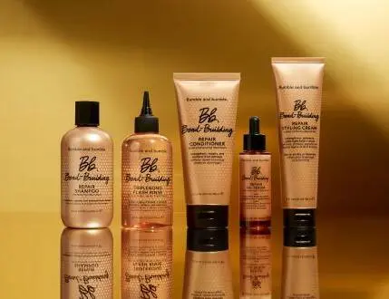 Her ses en guld baggrund med fem guld produkter.