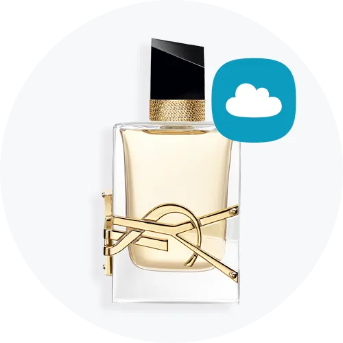 Her ses et billede af en parfumeflakon fra Yves Saint Laurent placeret mod en lys baggrund. Flakonen er i klart glas med guldfarvede detaljer og sort låg, og ved siden af ses et blåt ikon med en sky.