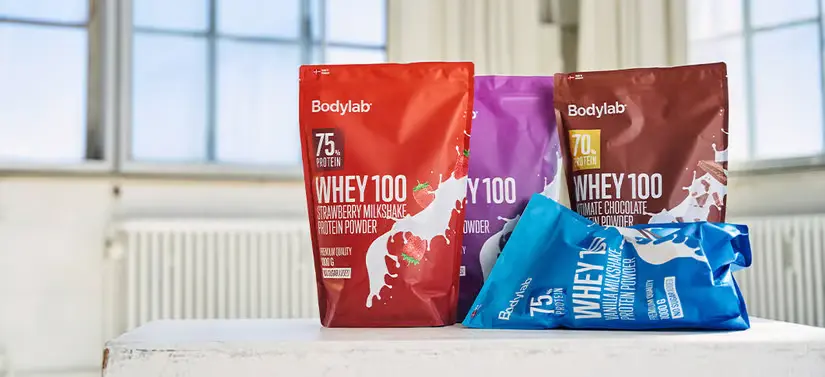 Her ses fire forskellige Bodylab produkter, som står på et bord i en lejlighed. 