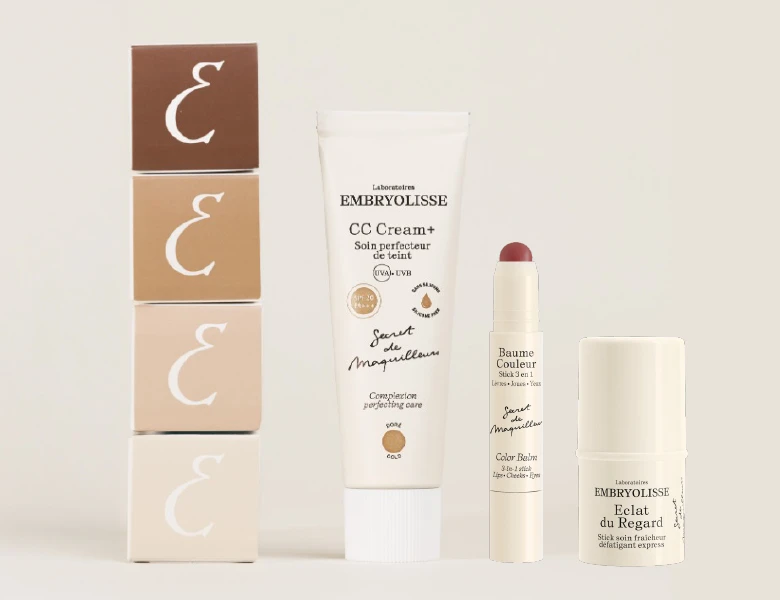 Her ses Embryolisse CC Cream+, Baume Couleur og Éclat du Regard sammen med fire æsker mod en lys beige baggrund.