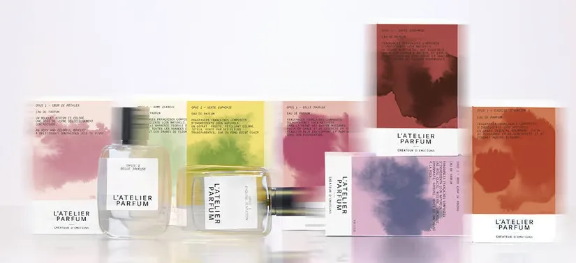 Her ses flere L'Atelier Parfum produkter på en hvid baggrund. 