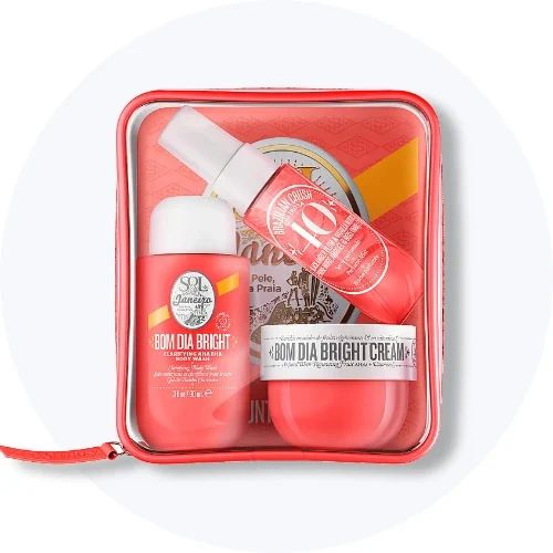 Sol de Janeiro Bom Dia Bright sæt i rød klar pose: BOM DIA BRIGHT CLARIFYING AHA/BHA BODY WASH, BRAZILIAN CRUSH 40, BOM DIA BRIGHT CREAM.