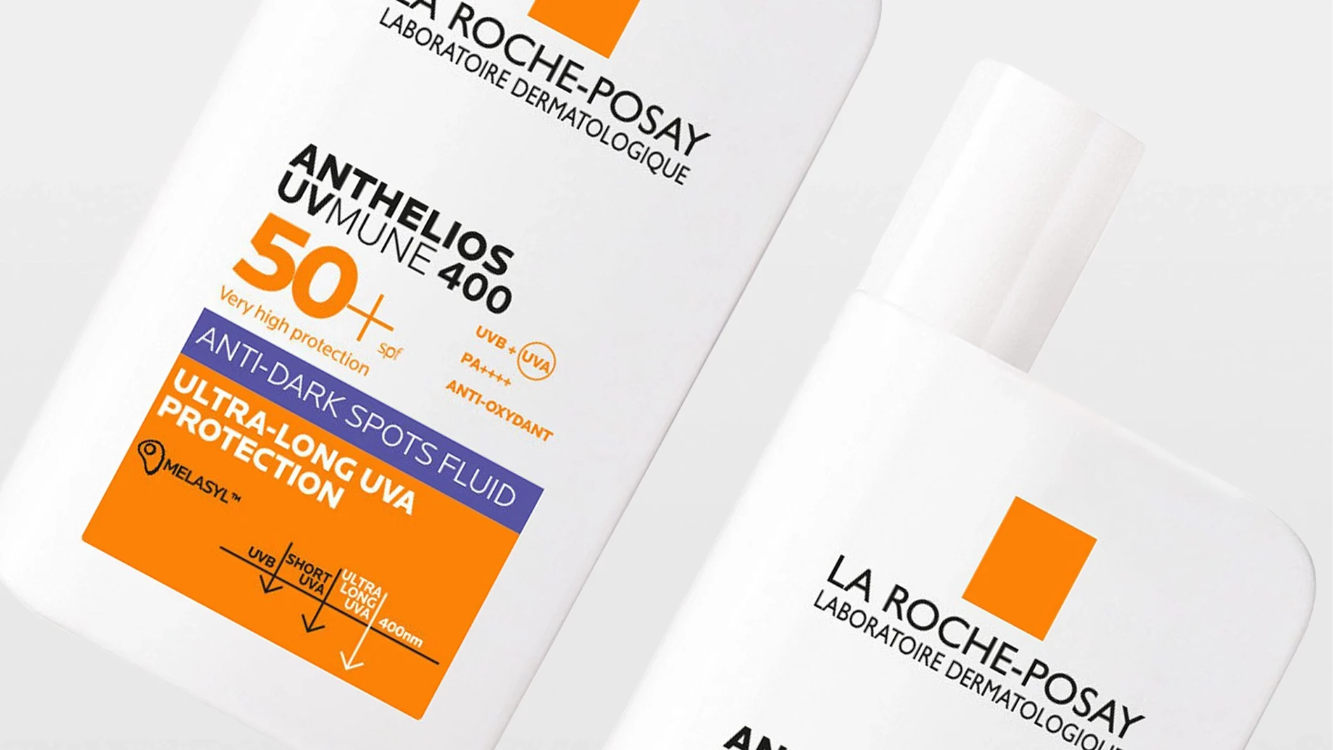 Två vita flaskor med solskyddet La Roche-Posay Anthelios UVMune 400 SPF 50+ syns mot ljus bakgrund. Förpackningen visar texten ”Very high protection 50+”, ”Anti-dark spots fluid” och ”Ultra-long UVA protection”.