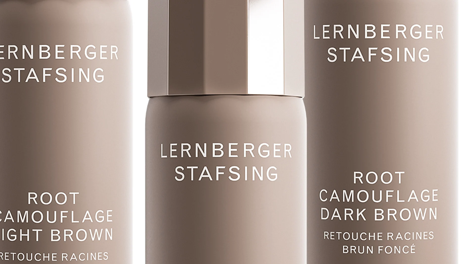 Tre flasker Root Camouflage Dark Blonde fra Lernberger Stafsing i ulik høyde, mot en hvit bakgrunn.