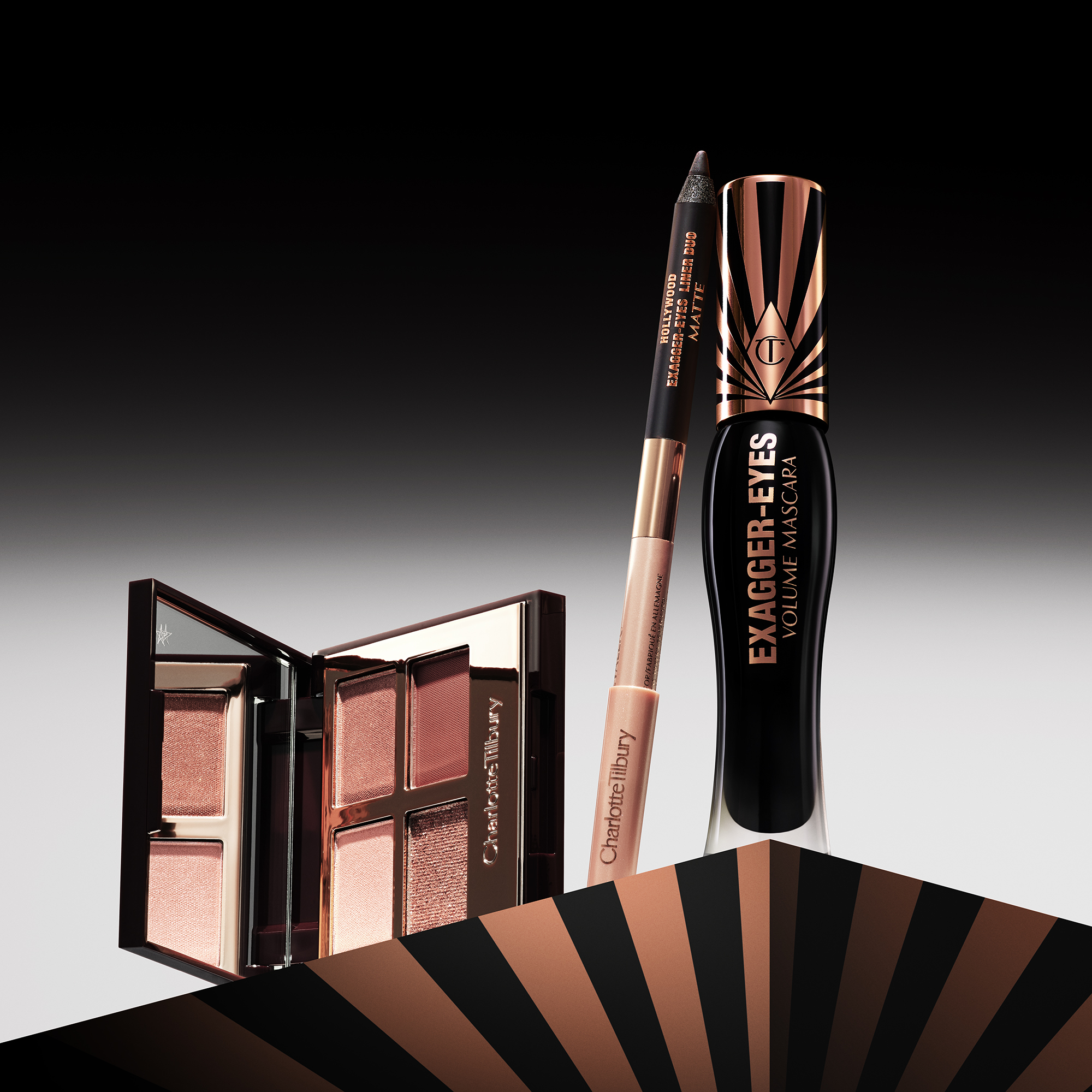 Charlotte Tilbury ögonmakeup-produkter, inklusive ögonskuggspalett, eyeliner och mascara.