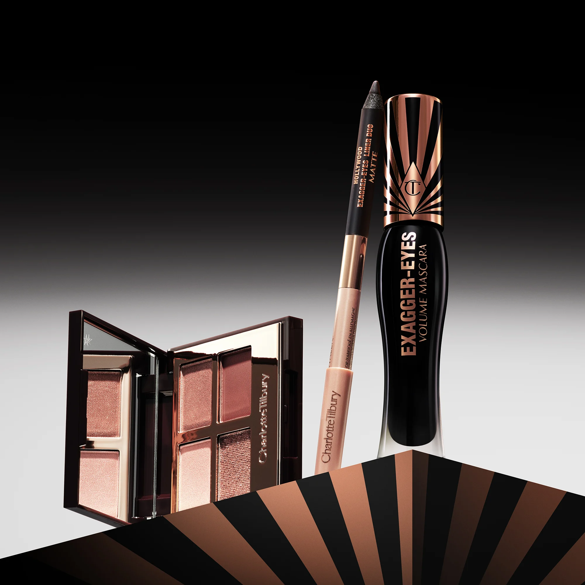 Charlotte Tilbury ögonmakeup-produkter, inklusive ögonskuggspalett, eyeliner och mascara.