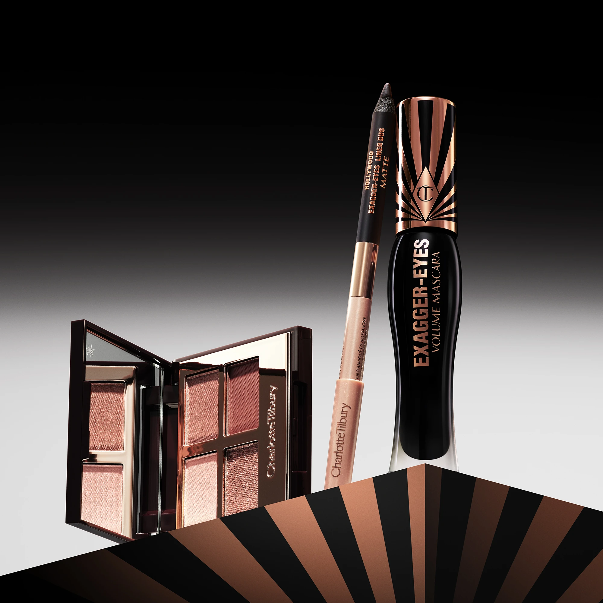  Charlotte Tilbury -silmämeikkituotteita, mukaan lukien luomiväripaletti, silmänrajauskynä ja ripsiväri.