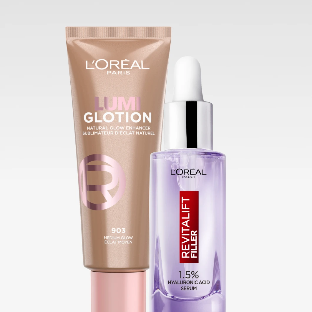 Kuva, joka näyttää kaksi L'Oréal tuotetta: ruskea tuubi L'Oréal Lumi Glotion ja lila pullo L'Oréal Revitalift Filler 1.5% Hyaluronic Acid Serum. Tausta on valkoinen.