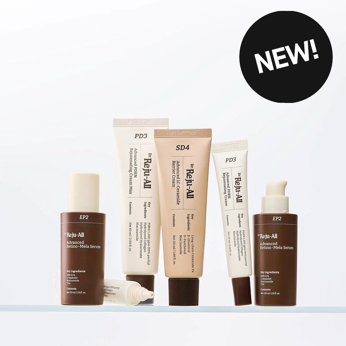 Ett urval av Dr. Reju-All hudvårdsprodukter, inklusive krämer och serum, med en 'NEW!' -etikett.