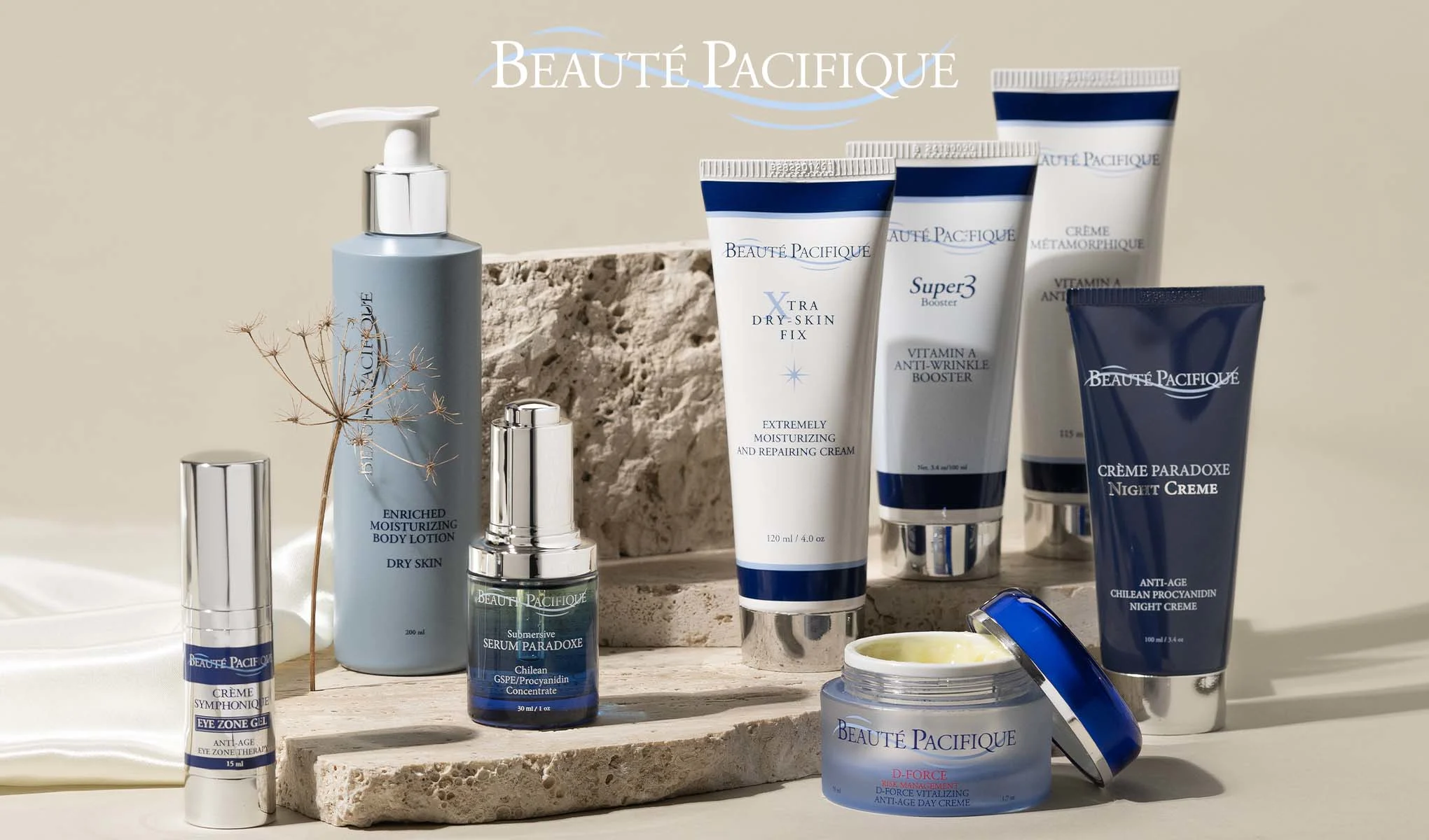 Beauté Pacifique -brändin ihonhoitotuotteiden kokoelma, tyylikkäästi aseteltu kivien ja vaalean taustan päälle. Tuotemerkin nimi Beauté Pacifique näkyy oikeassa yläkulmassa.