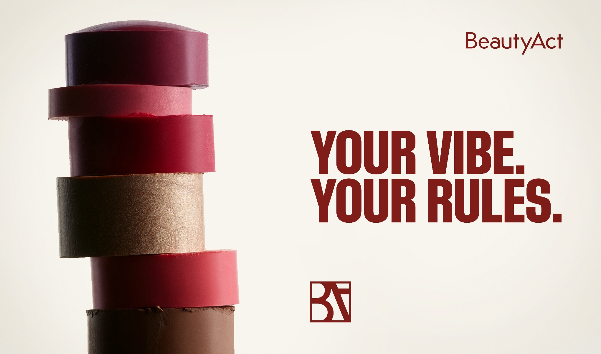Stablet kremmakeup i flere nyanser som rød, rosa, gull og brun mot lys bakgrunn, med teksten “BeautyAct” og “YOUR VIBE. YOUR RULES.” samt BA-logo.