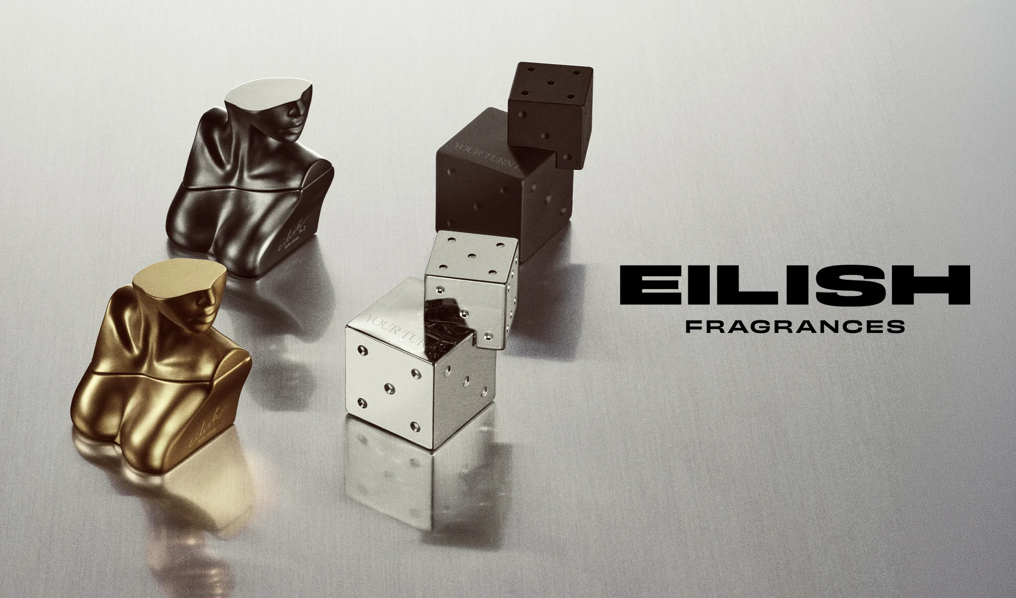 Eilish Fragrances-parfymflaskor och tärningar mot metallisk bakgrund.