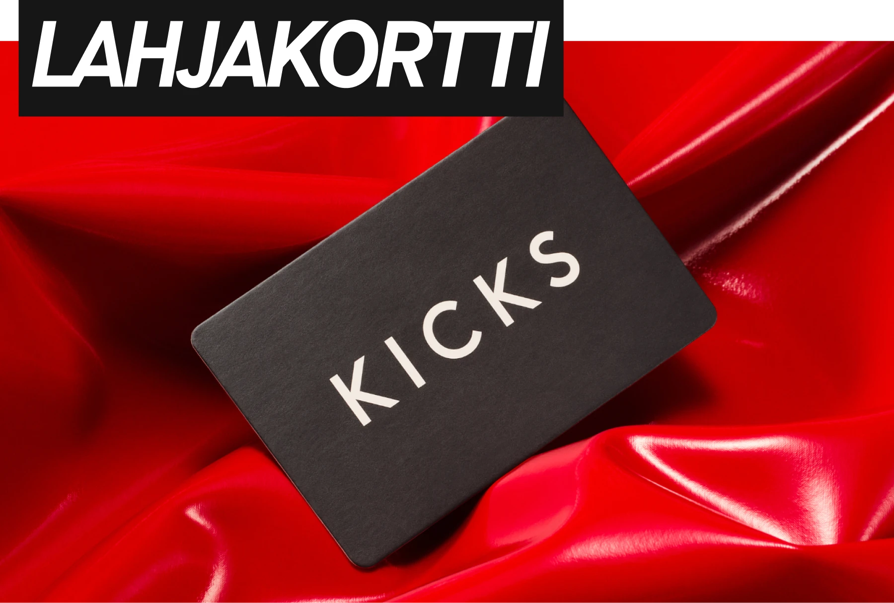 Musta KICKS-lahjakortti punaista taustaa vasten