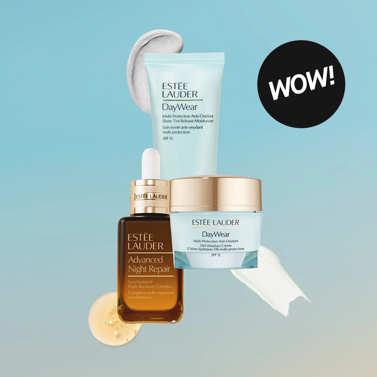Estée Lauder -tuotteet, mukaan lukien Advanced Night Repair -seerumi ja DayWear -kosteusvoiteet, esitetään vaaleansinisellä taustalla. Oikealla ylhäällä on musta ympyrä, jossa lukee "WOW!".