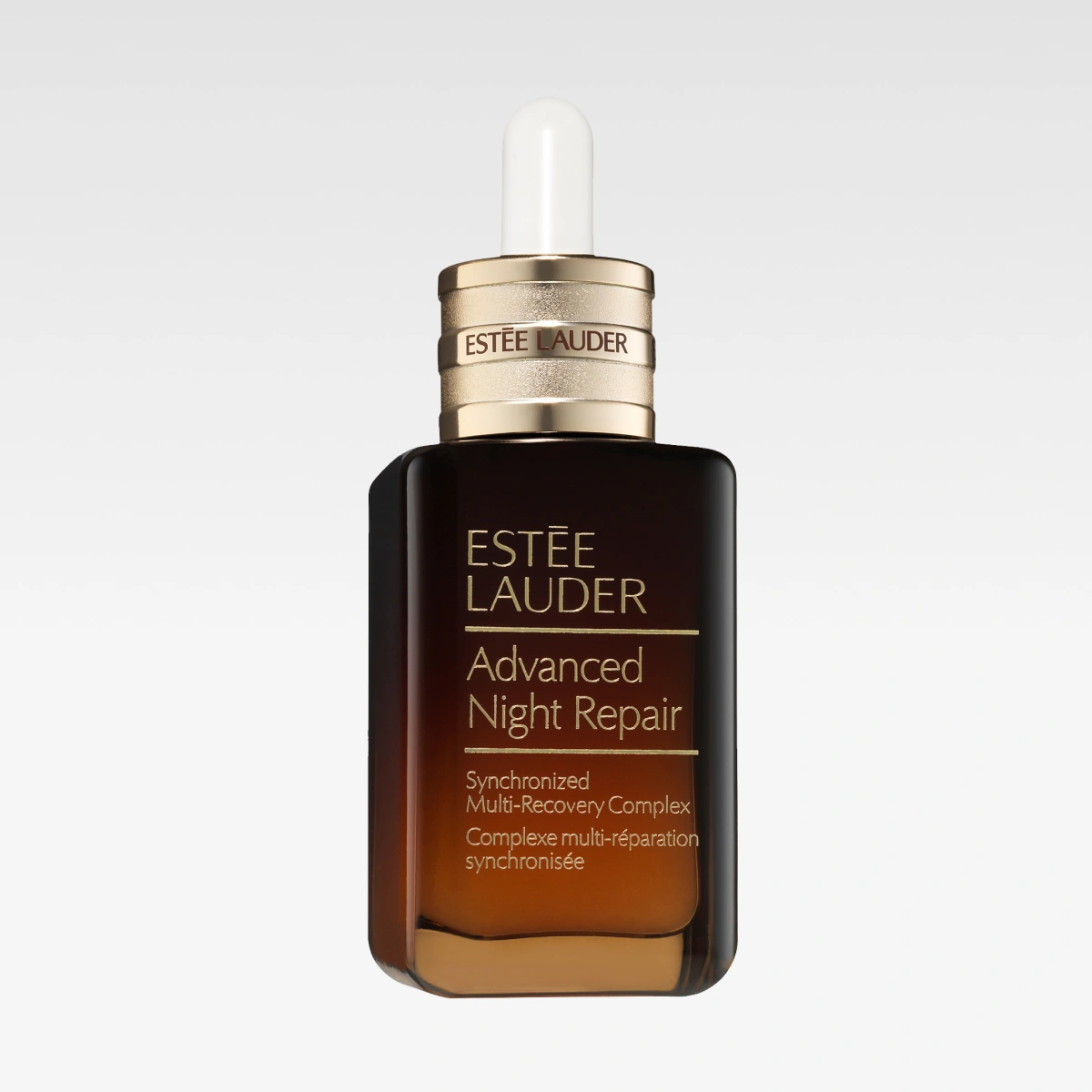 Brun glassflaske Estée Lauder Advanced Night Repair med pipette og tekst “Synchronized Multi-Recovery Complex”.