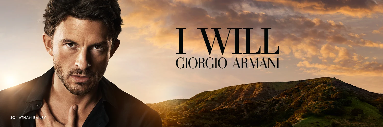 Man i kampanjbild för Giorgio Armani I Will i solnedgången.