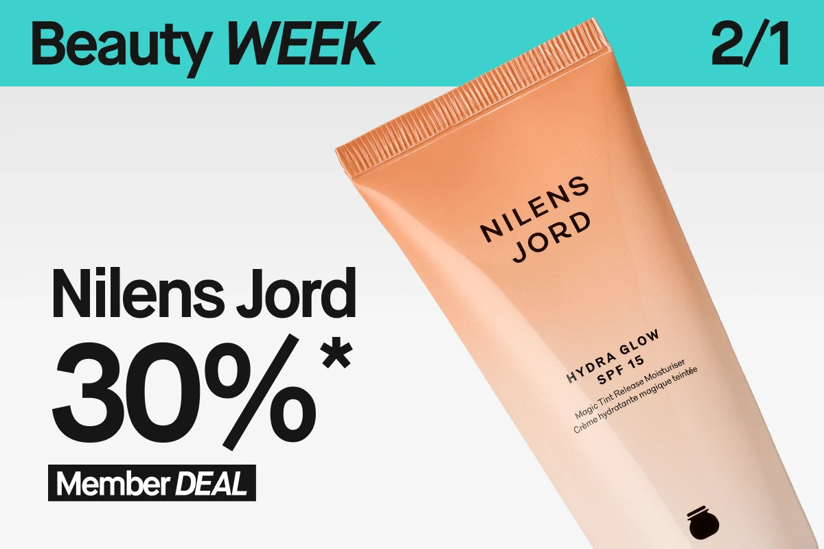 En närbild på Nilens Jord Hydra Glow SPF 15 i beige tub, lutad mot en ljus bakgrund. Ovanför syns en turkos banner med ”Beauty WEEK” och 2/1. I nederkanten står texten ”30%* Member DEAL”.