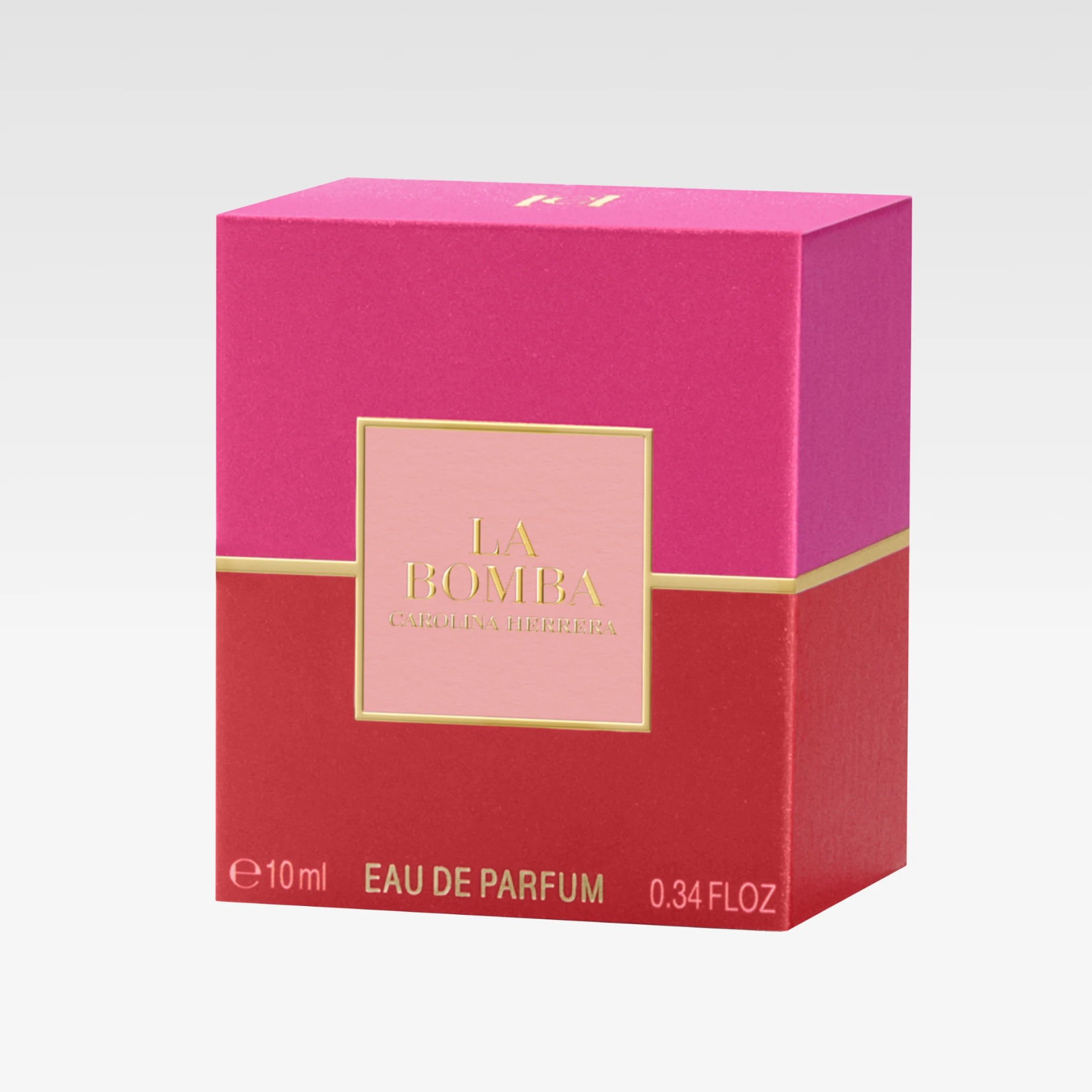 Carolina Herrera parfymförpackning i rosa och rött med gulddetaljer och texten "LA BOMBA Carolina Herrera", "EAU DE PARFUM 10 ml 0.34 FL.OZ".